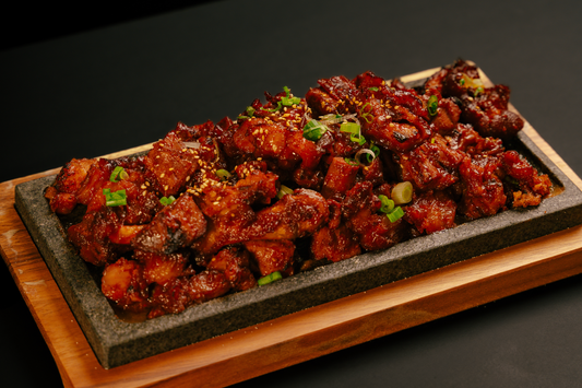 Boneless chicken feet grilled over charcoal